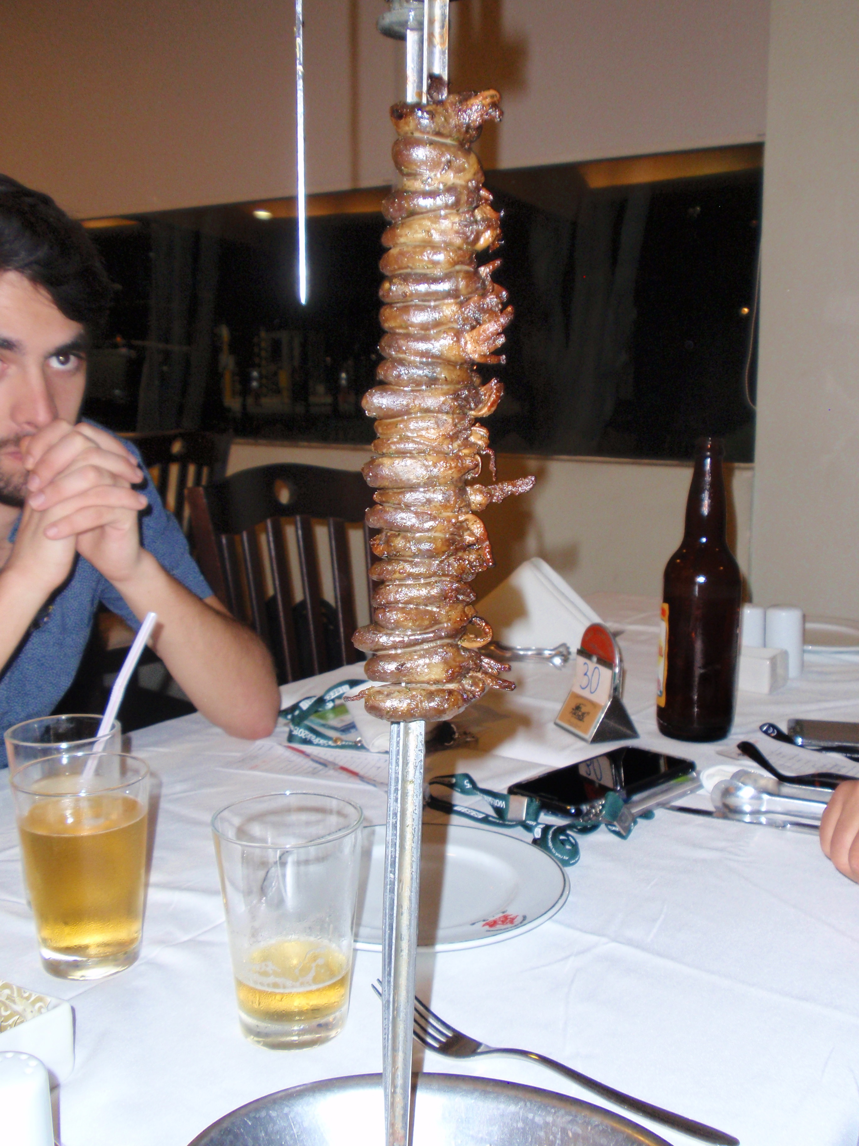 Meat being served at Brasilian restaurant