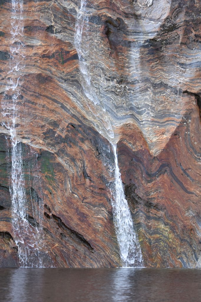 Water cascading down banded gneiss