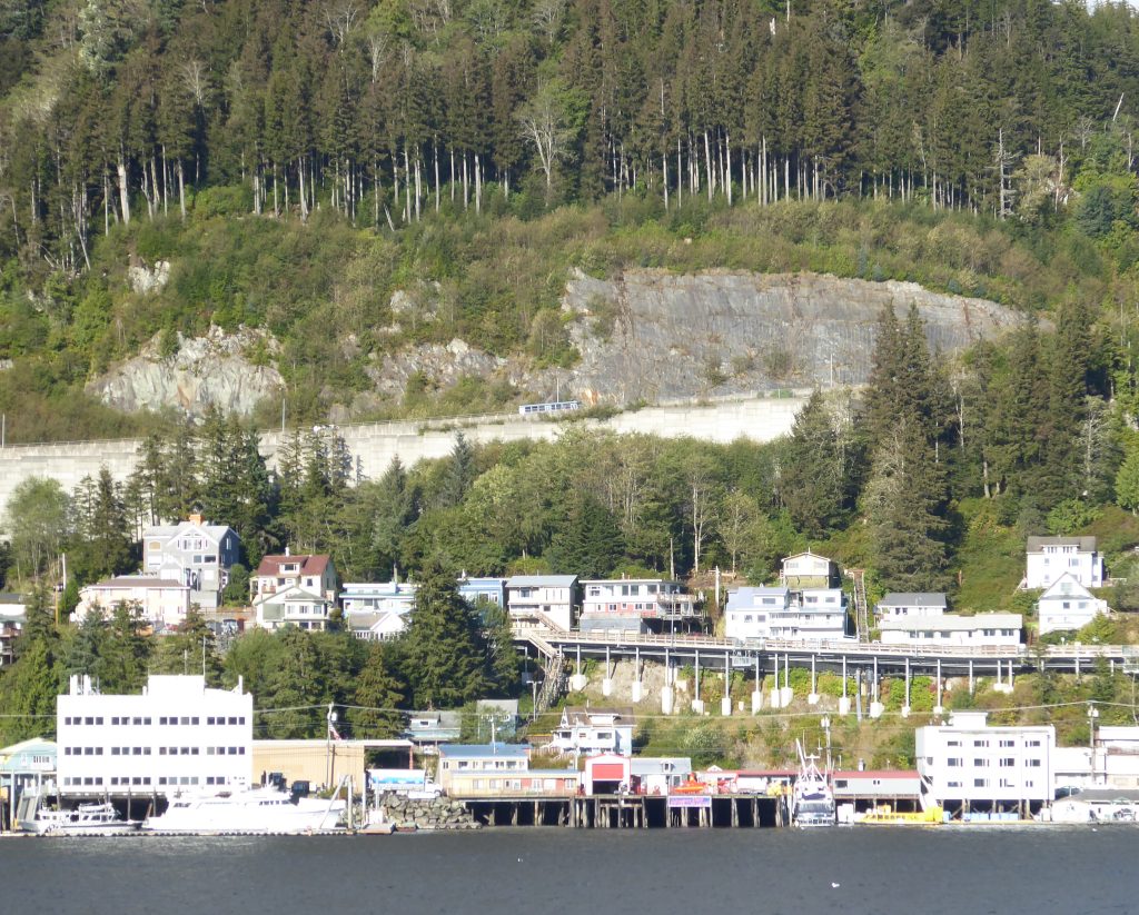 Ketchikan viewed from the ship with a large rock quarry also visible above the city.